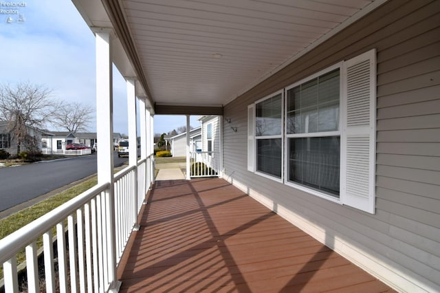 balcony with a residential view and a porch