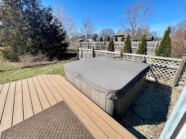 wooden terrace featuring a covered hot tub