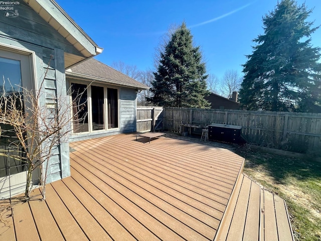 deck with a fenced backyard