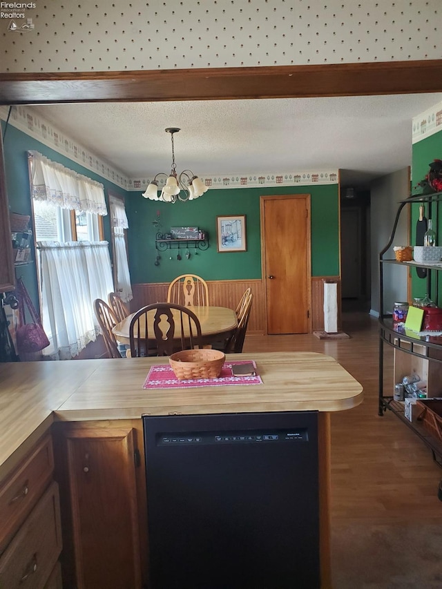 dining area featuring a chandelier and wood finished floors