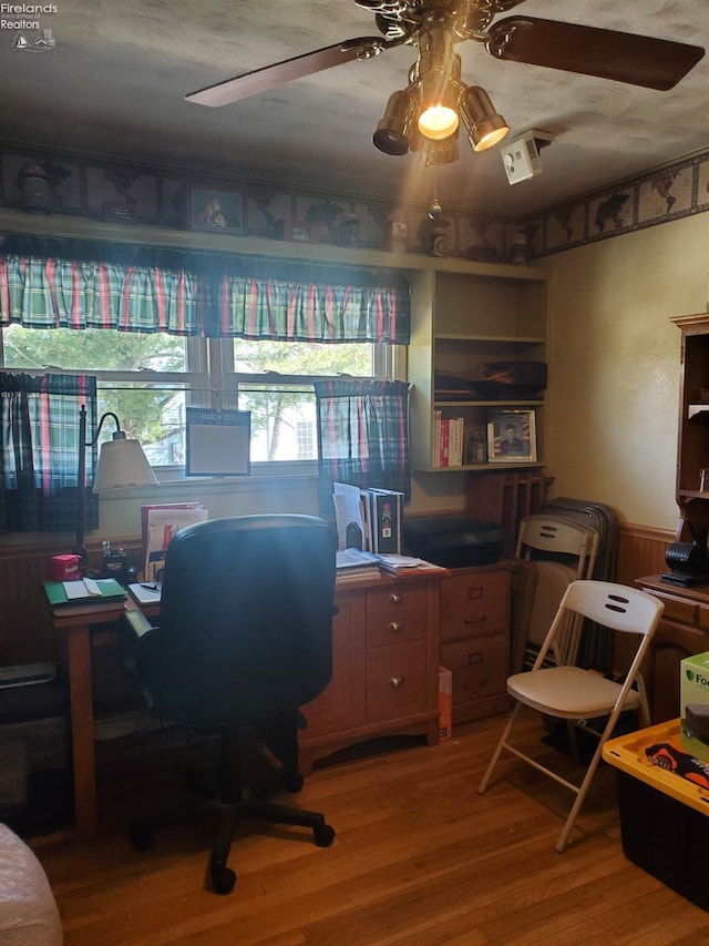 office featuring light wood-style floors and ceiling fan