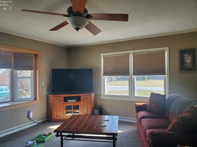 carpeted living room featuring a baseboard heating unit, a textured ceiling, a healthy amount of sunlight, and a ceiling fan