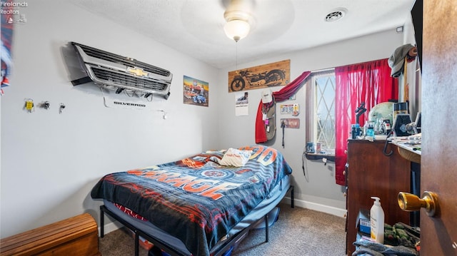 carpeted bedroom with a ceiling fan, baseboards, and visible vents