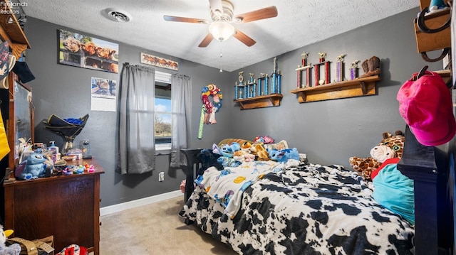 bedroom with visible vents, baseboards, a textured ceiling, and carpet flooring