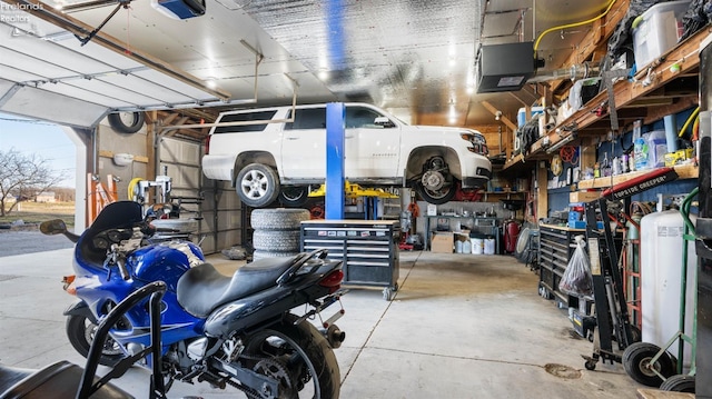 garage featuring a workshop area and a garage door opener