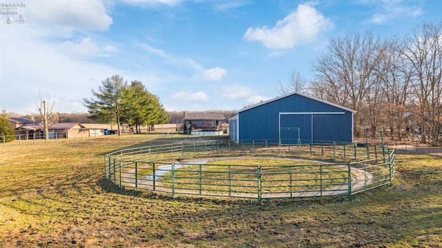 view of yard with an exterior structure, an outbuilding, an outdoor structure, and fence