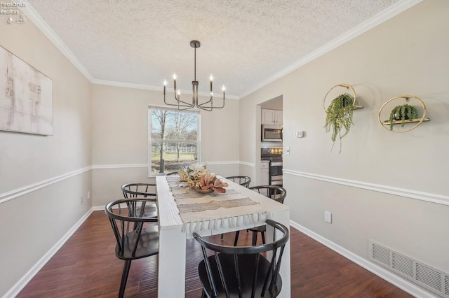 dining room featuring visible vents, a textured ceiling, an inviting chandelier, and dark wood-style floors