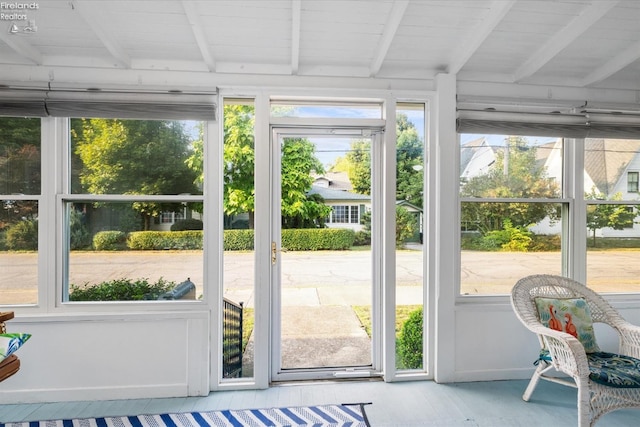 sunroom / solarium with beamed ceiling