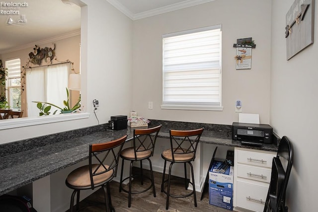 office space featuring wood finished floors and ornamental molding