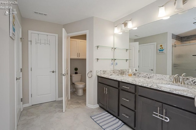 full bathroom with a sink, visible vents, a stall shower, and double vanity