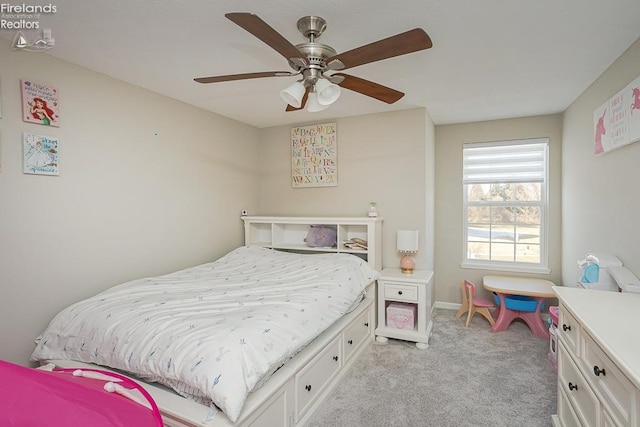 bedroom with light colored carpet and a ceiling fan