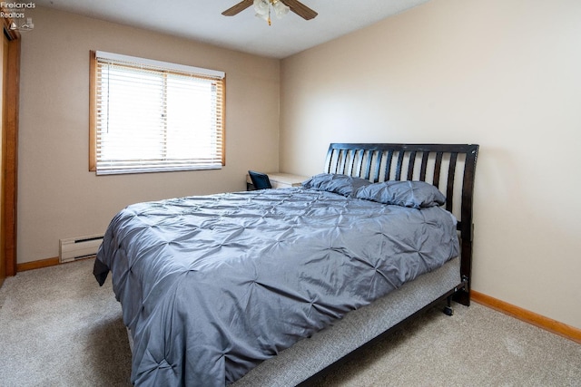 5041 State Route 99, Monroeville, OH 44847 - carpeted bedroom with a baseboard heating unit, baseboards, and ceiling fan