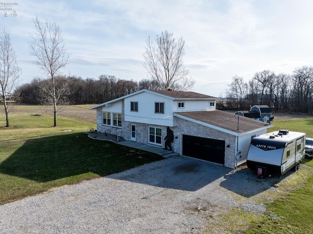 5041 State Route 99, Monroeville, OH 44847 - traditional-style house featuring a front yard, an attached garage, and driveway