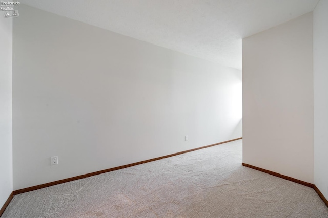 1789 N Windward Dr, Port Clinton, OH 43452 - spare room featuring baseboards and carpet floors