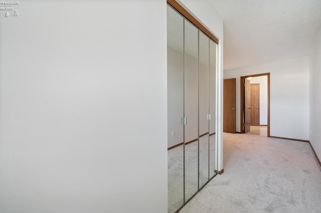 1789 N Windward Dr, Port Clinton, OH 43452 - corridor with baseboards and light carpet
