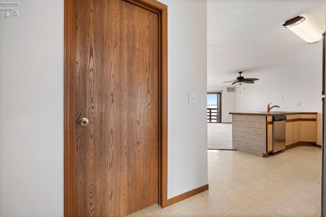 1789 N Windward Dr, Port Clinton, OH 43452 - hallway featuring a sink, visible vents, and baseboards