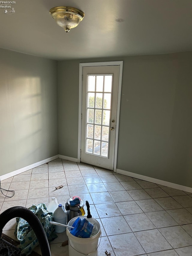 424 N Ridge Rd, Willard, OH 44890 - empty room with light tile patterned flooring and baseboards