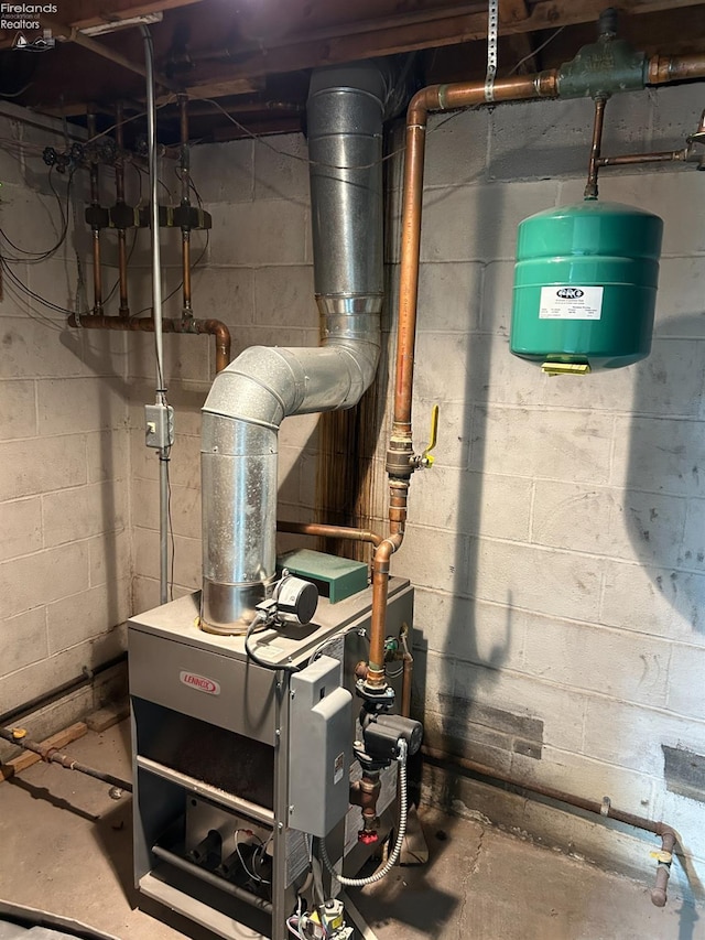 424 N Ridge Rd, Willard, OH 44890 - utility room with a heating unit