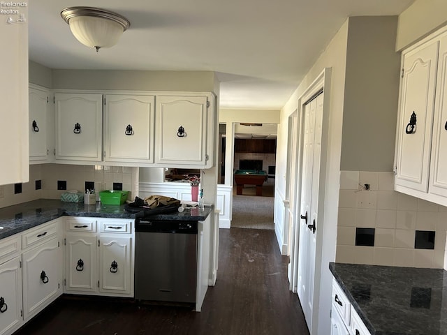 424 N Ridge Rd, Willard, OH 44890 - kitchen featuring dark stone counters, tasteful backsplash, dishwasher, and white cabinets