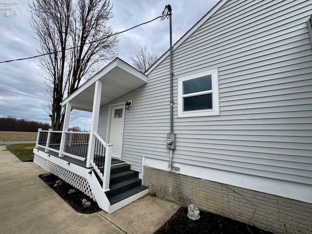 doorway to property with a porch