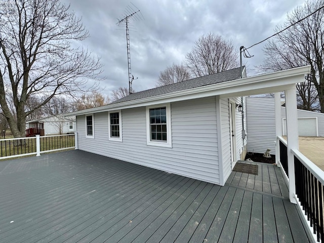 wooden deck with a garage