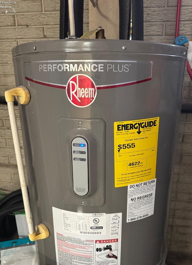 utility room featuring electric water heater
