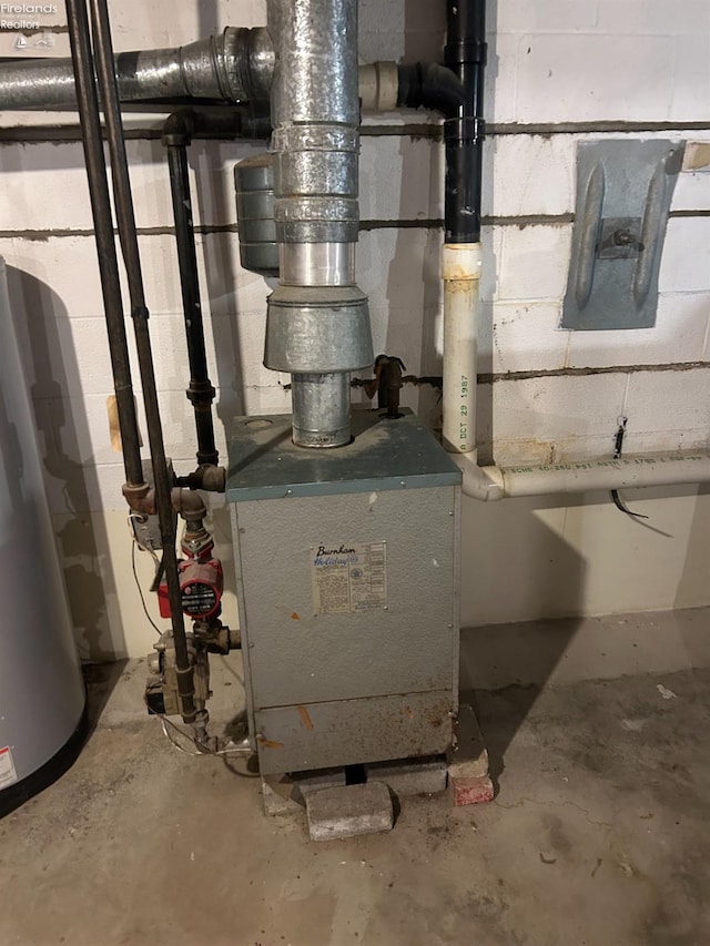 utilities featuring water heater and a heating unit