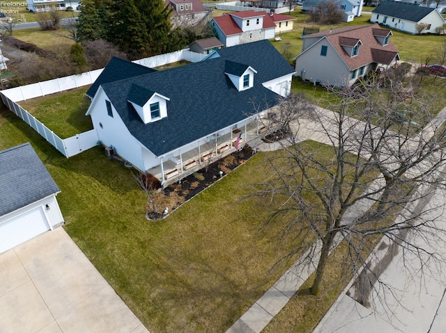 birds eye view of property with a residential view