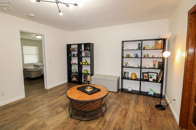 sitting room featuring wood finished floors and baseboards