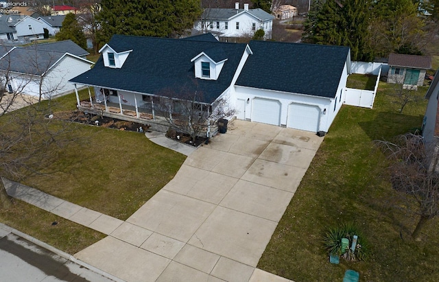 birds eye view of property with a residential view