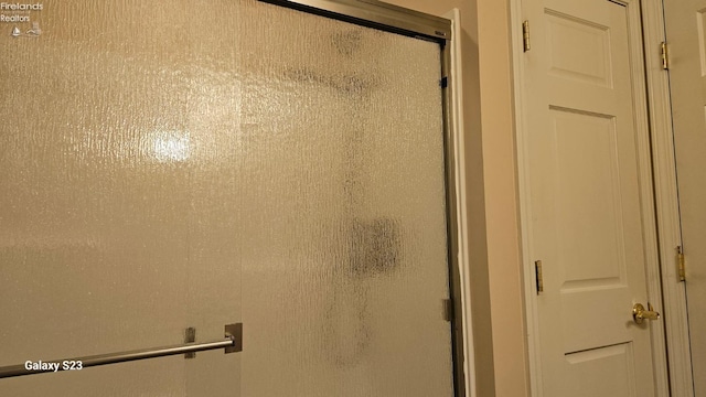 bathroom with a shower stall