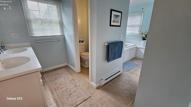 bathroom featuring a baseboard radiator, toilet, a sink, and a bath