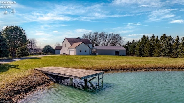 dock area featuring a water view and a lawn