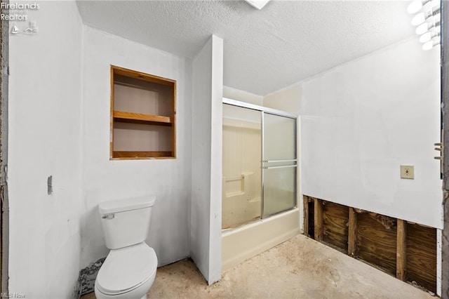 bathroom featuring a textured ceiling, unfinished concrete floors, toilet, and shower / bath combination with glass door