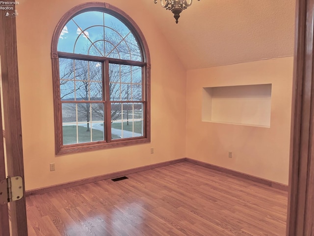 6276 County Road 33, Helena, OH 43435 - empty room featuring a wealth of natural light, visible vents, and wood finished floors