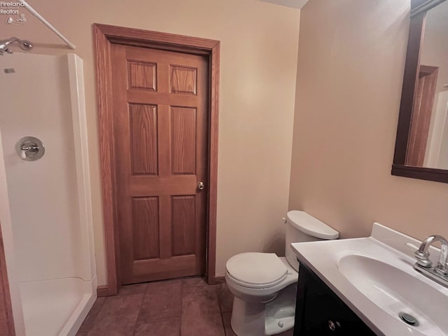 6276 County Road 33, Helena, OH 43435 - bathroom with a shower stall, tile patterned floors, vanity, and toilet