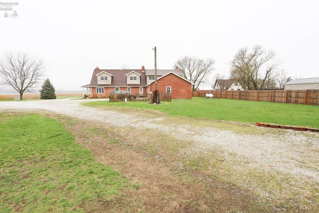 6276 County Road 33, Helena, OH 43435 - view of front of home featuring a front yard, driveway, and fence