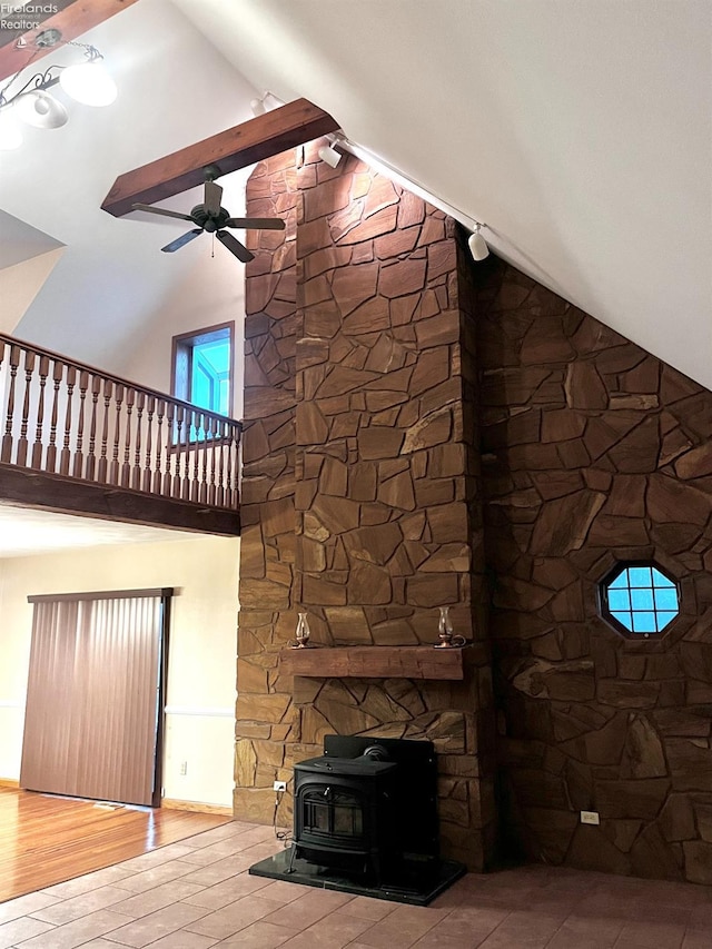 6276 County Road 33, Helena, OH 43435 - unfurnished living room featuring high vaulted ceiling, a wood stove, a ceiling fan, and wood finished floors
