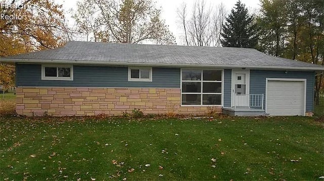 3719 County Road 213, Clyde, OH 43410 - ranch-style house with a garage, a front yard, and stone siding