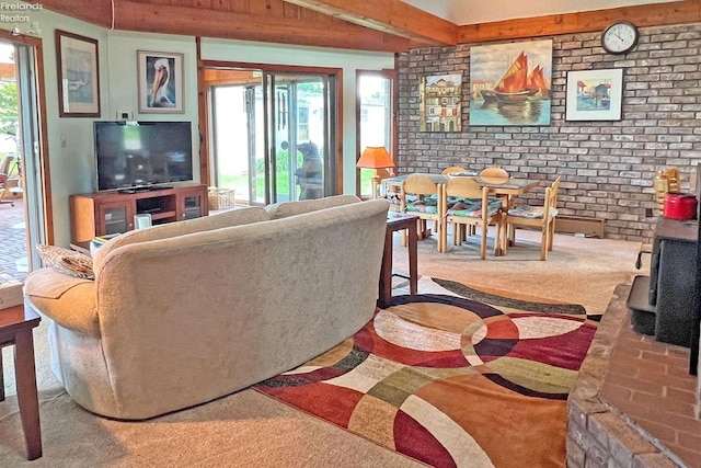 208 Johanna Ln, Kelleys Island, OH 43438 - living area featuring carpet flooring, a wealth of natural light, and brick wall