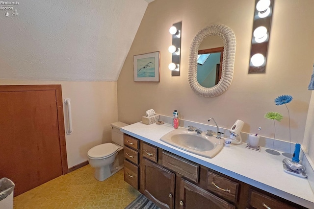 208 Johanna Ln, Kelleys Island, OH 43438 - bathroom featuring toilet, vanity, lofted ceiling, and a textured ceiling