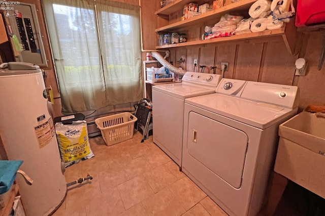 208 Johanna Ln, Kelleys Island, OH 43438 - laundry room with water heater, light tile patterned floors, separate washer and dryer, a sink, and laundry area
