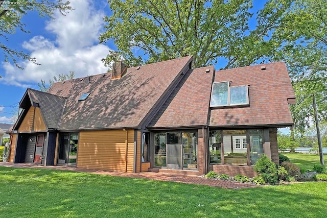 208 Johanna Ln, Kelleys Island, OH 43438 - back of house featuring a chimney, a shingled roof, and a yard