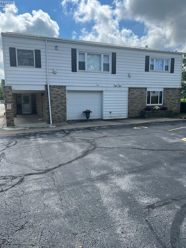 5414 Homegardner, Castalia, OH 44824 - view of front of property with a garage and aphalt driveway