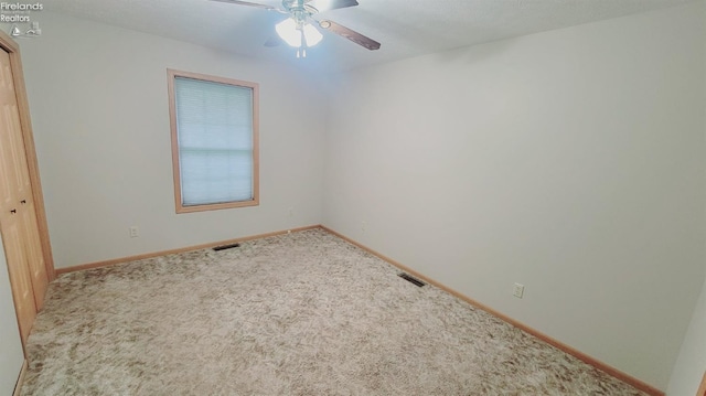 100 Grand Ave, Clyde, OH 43410 - carpeted spare room featuring baseboards, ceiling fan, and visible vents