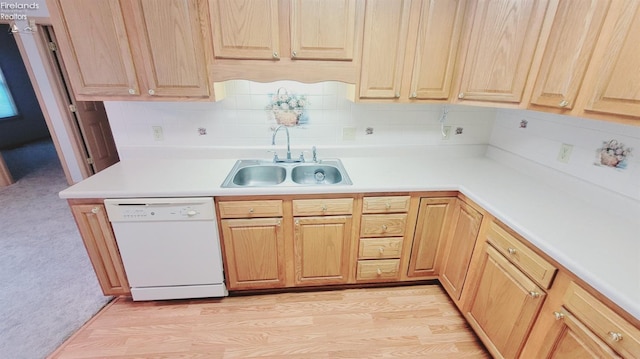 100 Grand Ave, Clyde, OH 43410 - kitchen featuring light countertops, light wood finished floors, dishwasher, tasteful backsplash, and a sink