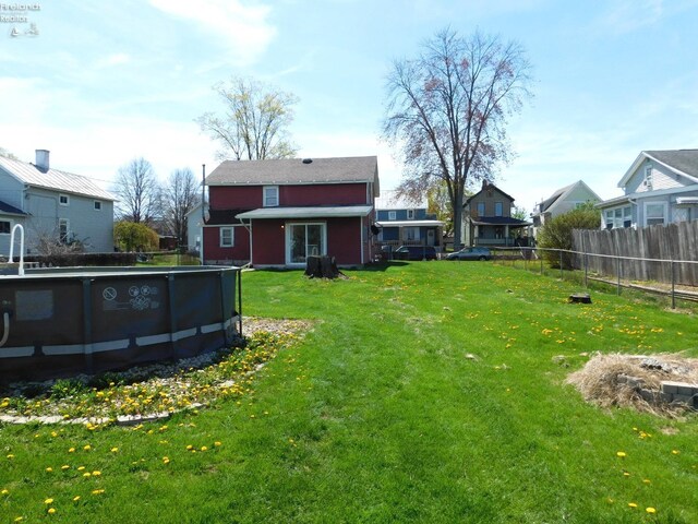 29 Walker St, Tiffin, OH 44883 - view of yard featuring fence, a residential view, and a fenced in pool