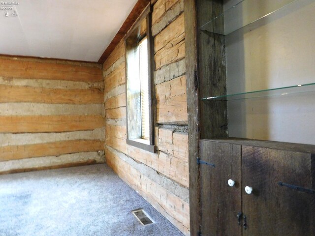 29 Walker St, Tiffin, OH 44883 - interior space featuring visible vents, plenty of natural light, and wood walls