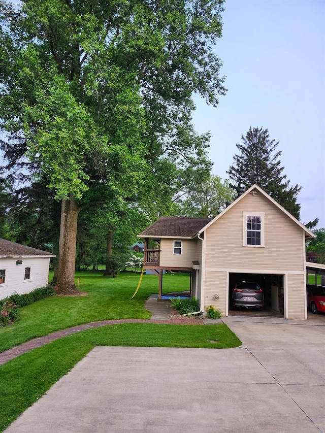 191 W Main St, Norwalk, OH 44857 - view of front of home featuring an attached garage, a front lawn, and driveway
