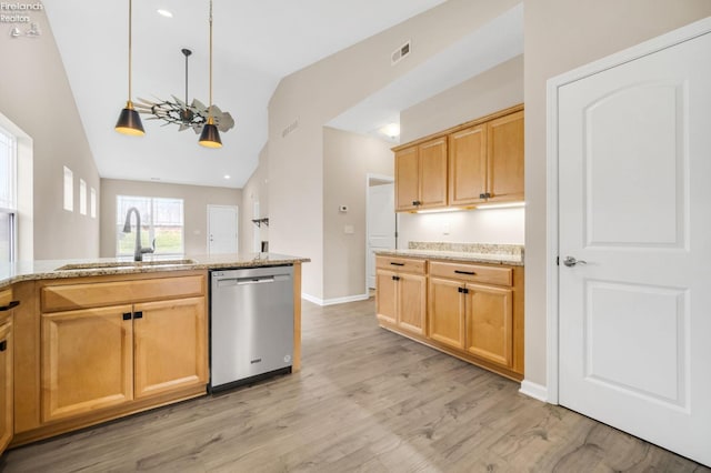 kitchen with lofted ceiling, light wood finished floors, visible vents, stainless steel dishwasher, and a sink
